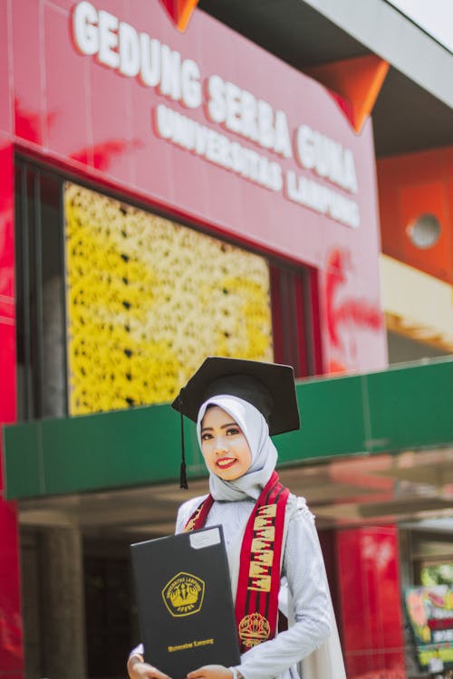 A Woman in White Hijab Graduating College