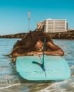 Woman in Blue Bikini on Blue Surfboard