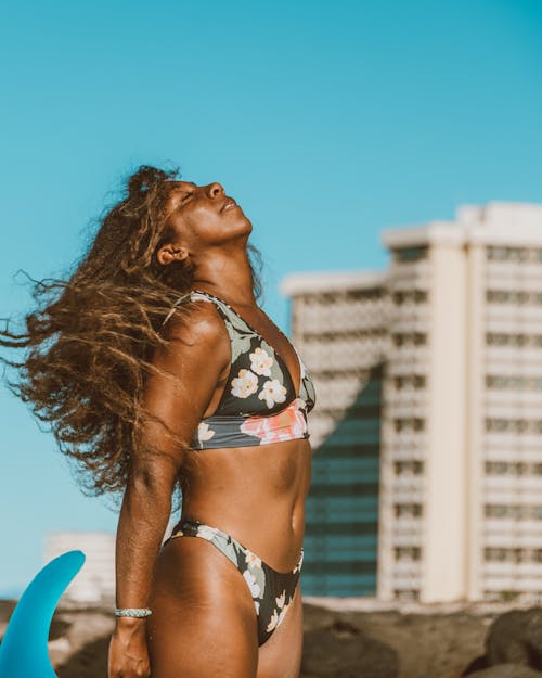 Woman Wearing Floral Bikini Standing on the Beach