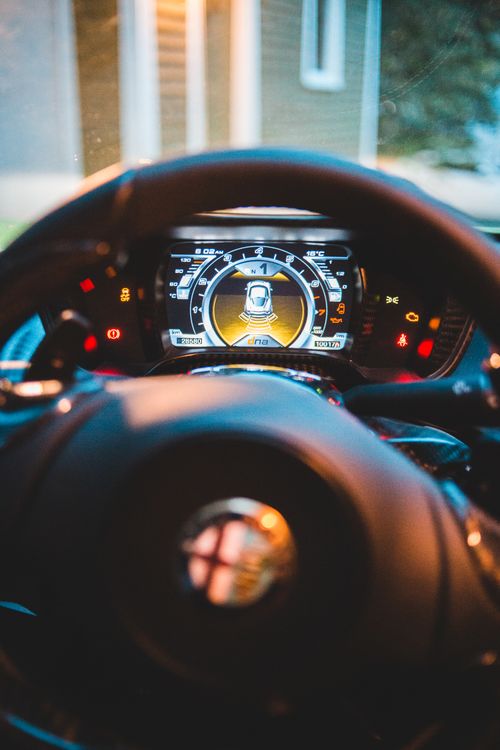 Free Colorful dashboard with numbers and scale on shiny display near steering wheel in modern automobile Stock Photo