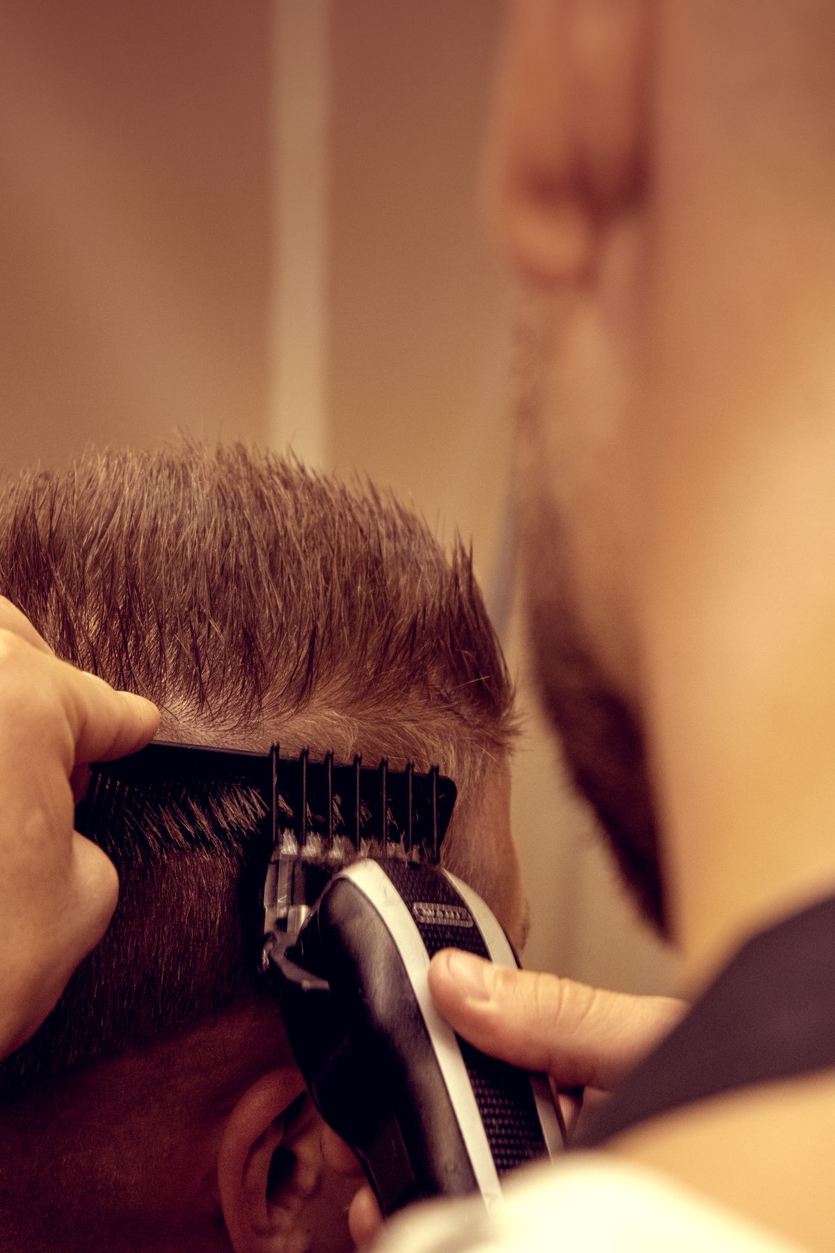Student completing a premium haircut