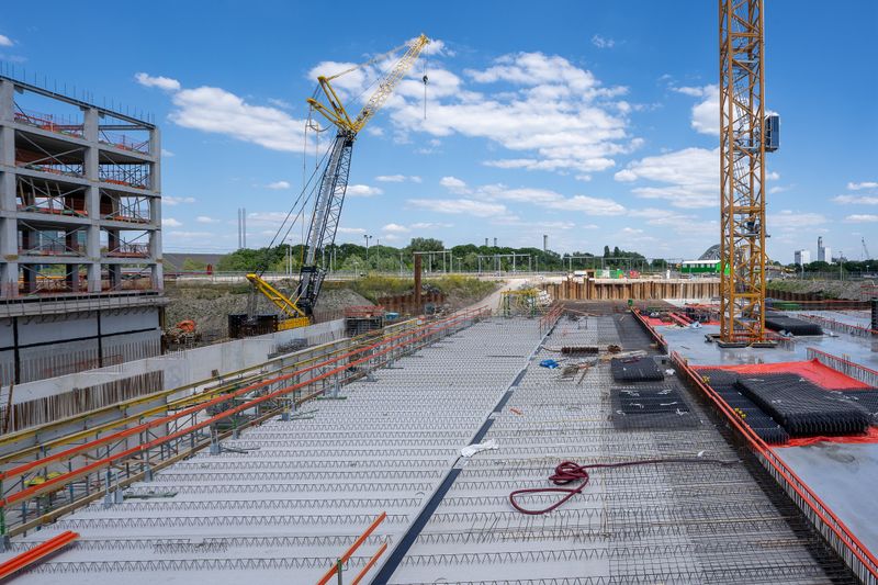 Construction site with cranes and a building structure