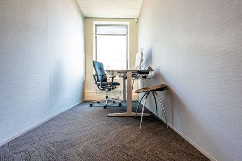 Desk and Chair in front of Window