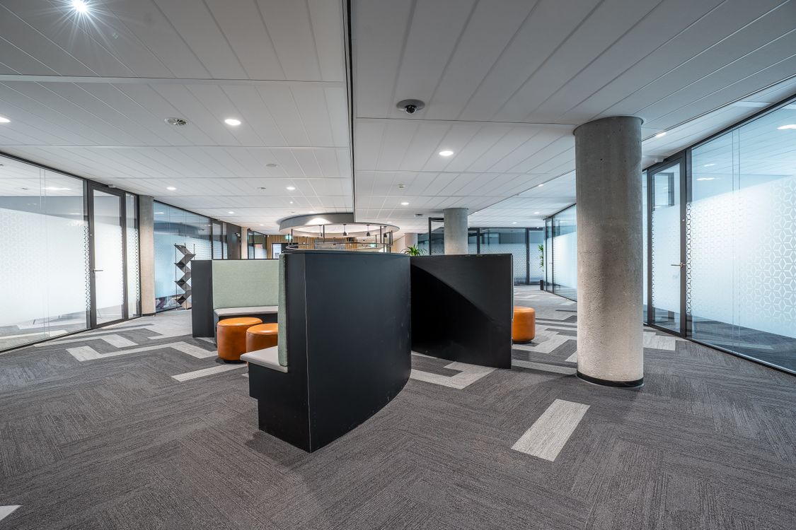 Modern open office interior with workstations and circulation space