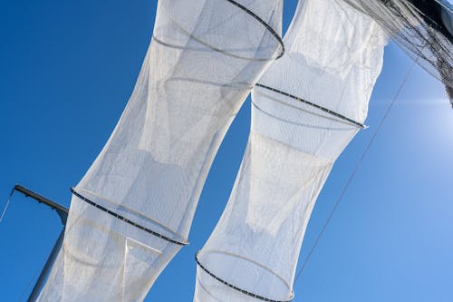 Hanging Fishing Nets on the Background of a Blue Sky 