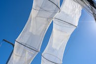 Hanging Fishing Nets on the Background of a Blue Sky