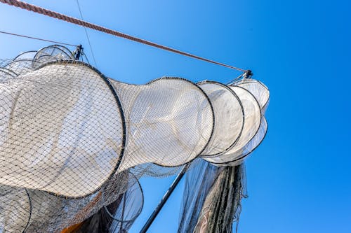 Hanging Fishing Nets on the Background of a Blue Sky