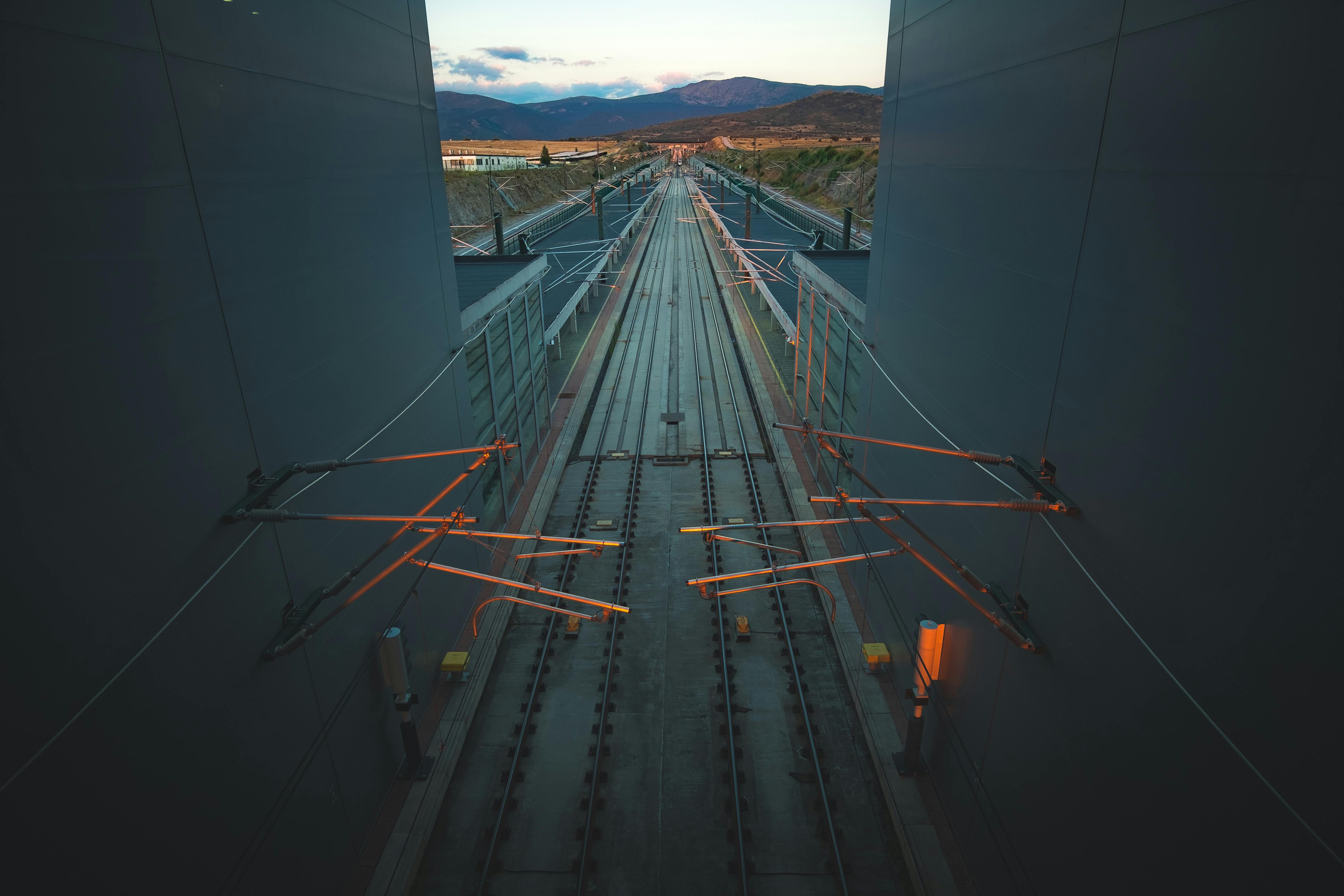A captivating view of high-speed railway tracks in Segovia, Spain, highlighting modern transportation infrastructure.
