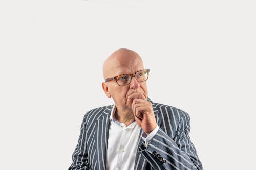 An Elderly Man with Eyeglasses Wearing a Striped Coat