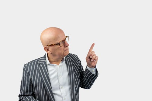 Free A Man Pointing His Finger Upward Stock Photo