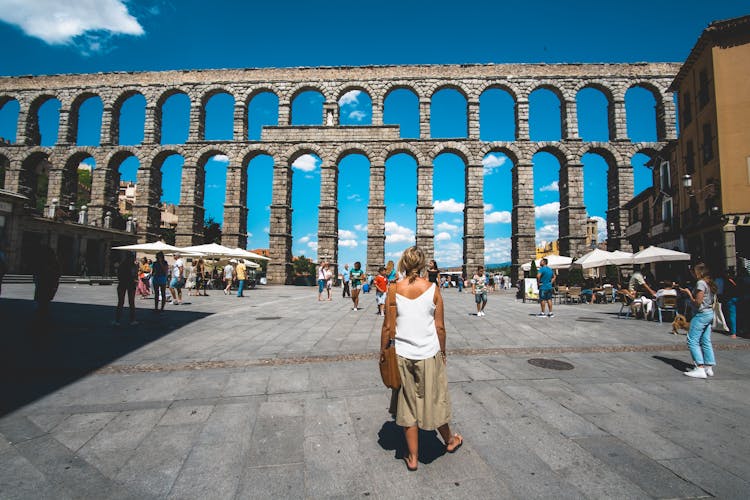 Tourists Visits The Aqueduct In Segovia Spain