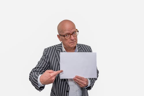 Man in Gray Striped Long Sleeve Shirt Holding White Paper