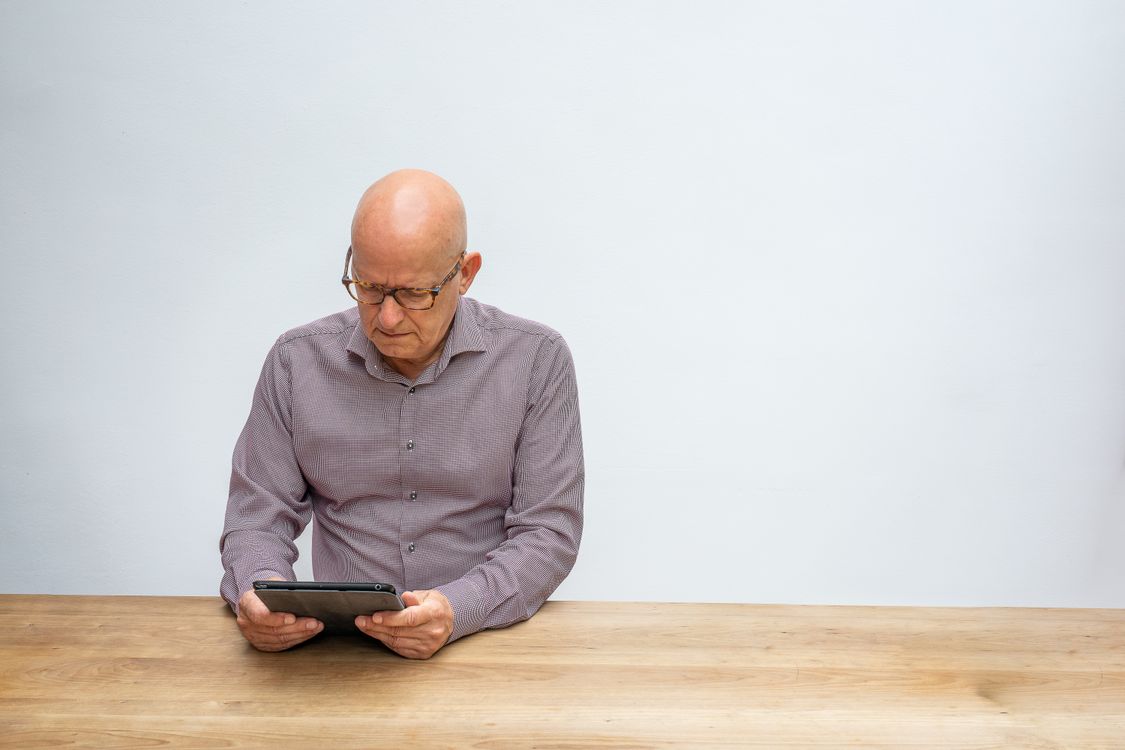 Portrait of Man Using Tablet · Free Stock Photo
