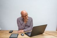 Man in Gray Dress Shirt Using Laptop Computer