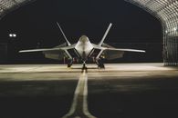 Black Fighter Jet on the Road during Night Time
