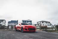 Red Chevrolet Camaro on Road