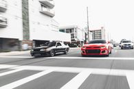 Black and Red Cars on Road