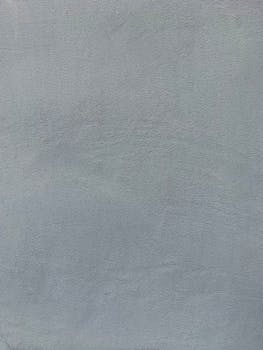 High-quality close-up of a smooth gray cement texture perfect for backgrounds or designs.
