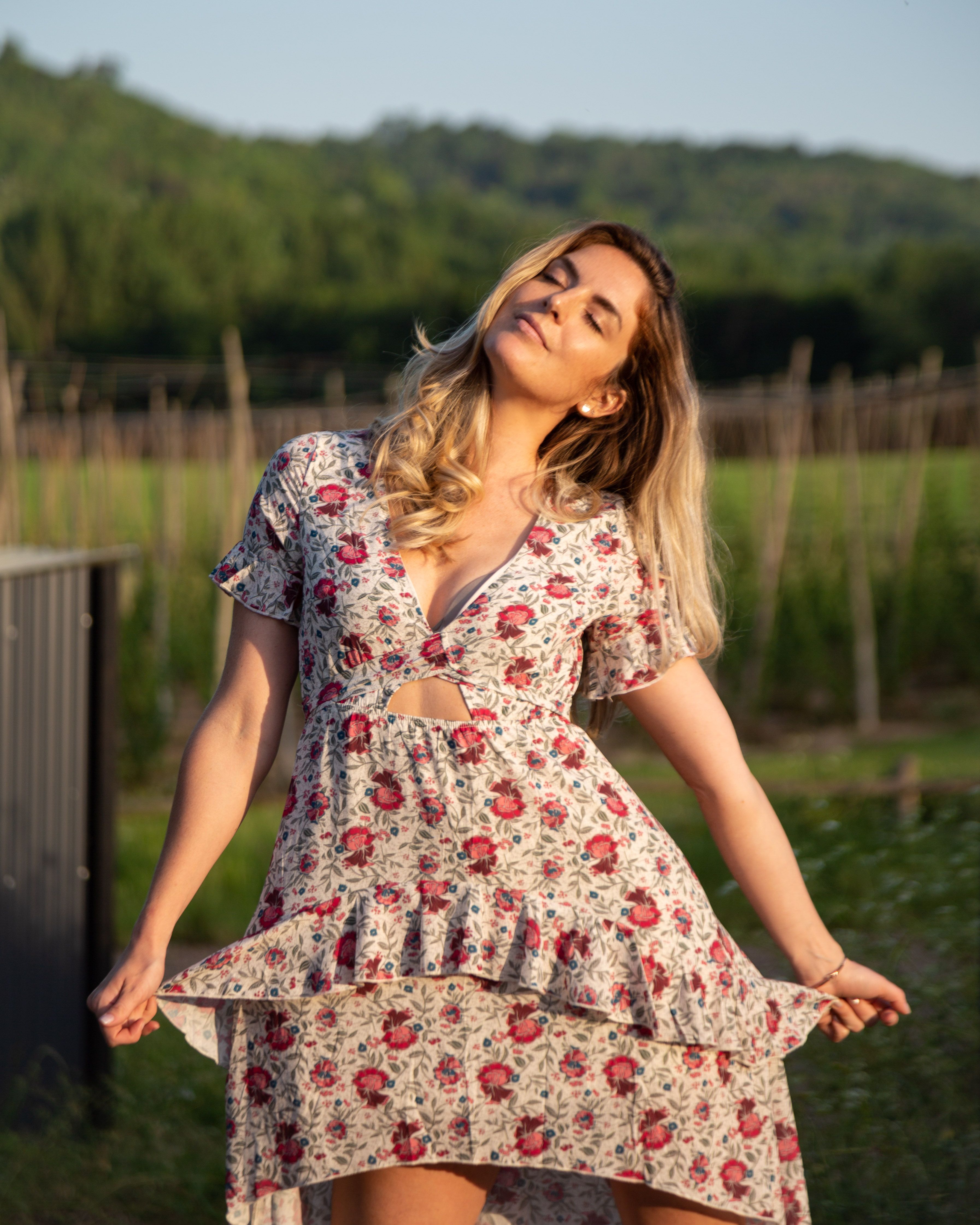 Girl in White Dress Sitting on Green Grass Field · Free Stock Photo
