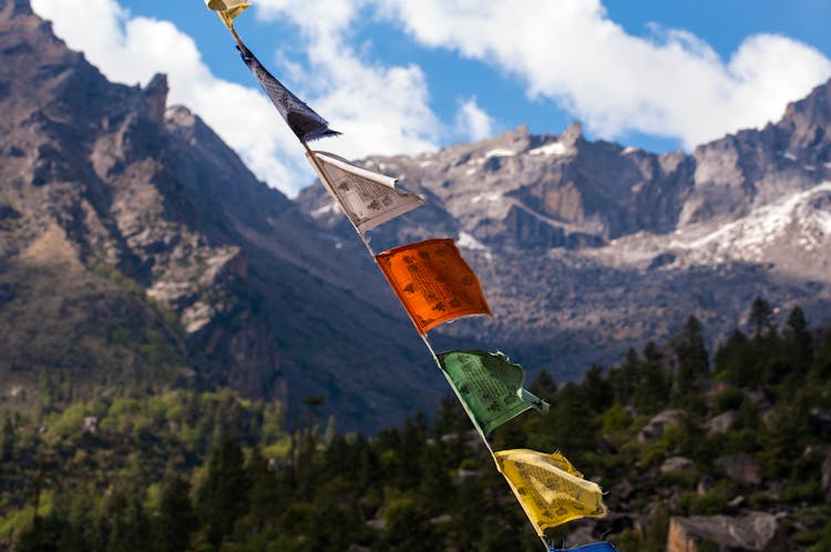 Scenic Mountain Landscape And Colorful Flags