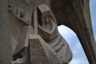 Gray Concrete Statue Under Cloudy Sky