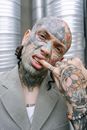 Man in Grey Suit With Face Paint