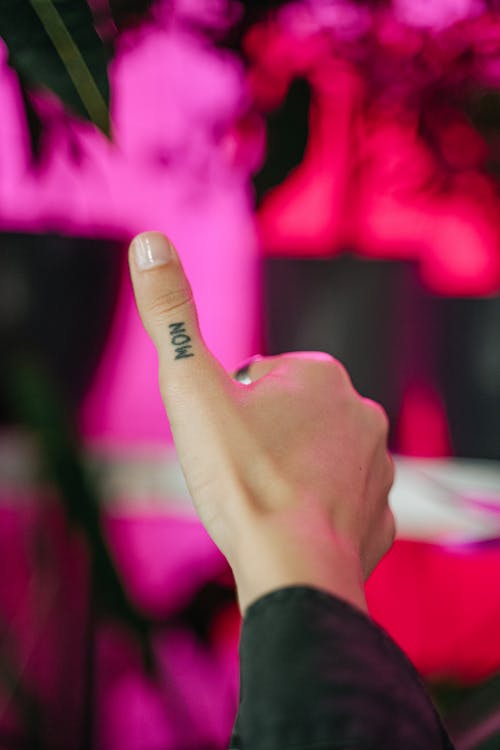 Free A Person with Finger Tattoo on Thumb Stock Photo