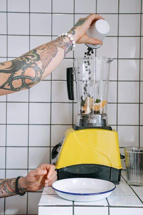 Free Pouring of Ingredients on a Blender Stock Photo