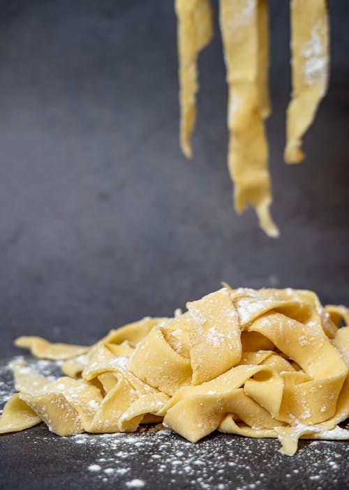 Yellow Pasta on Black Surface