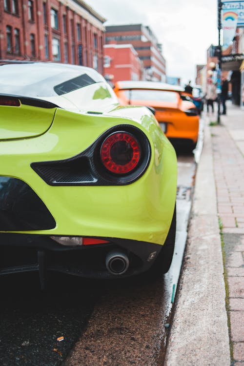 Modern sports cars parked on street