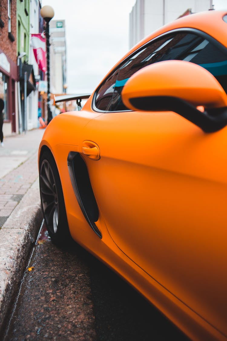 Bright Orange Modern Sports Car On Street