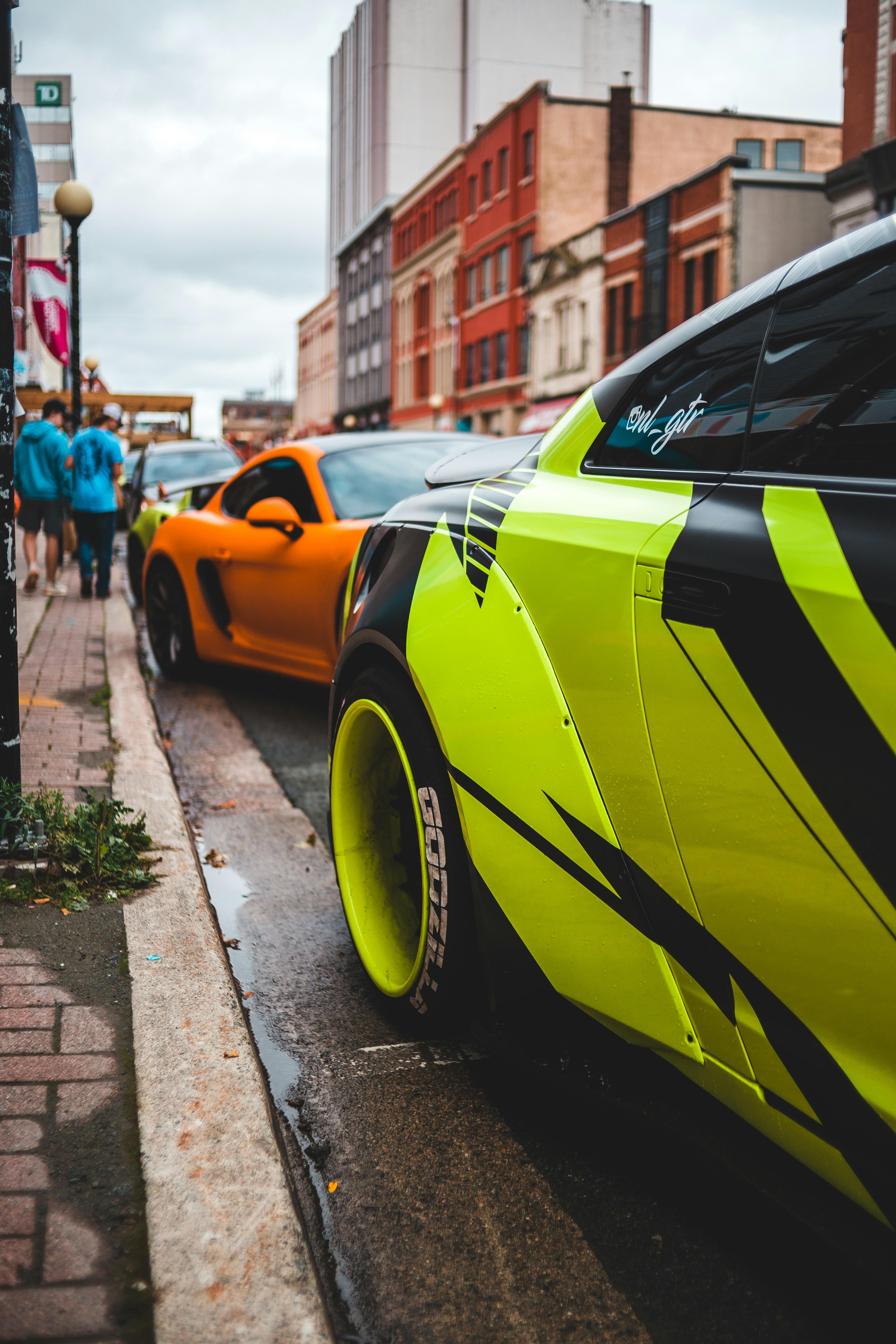 Bright sports cars parked on street · Free Stock Photo