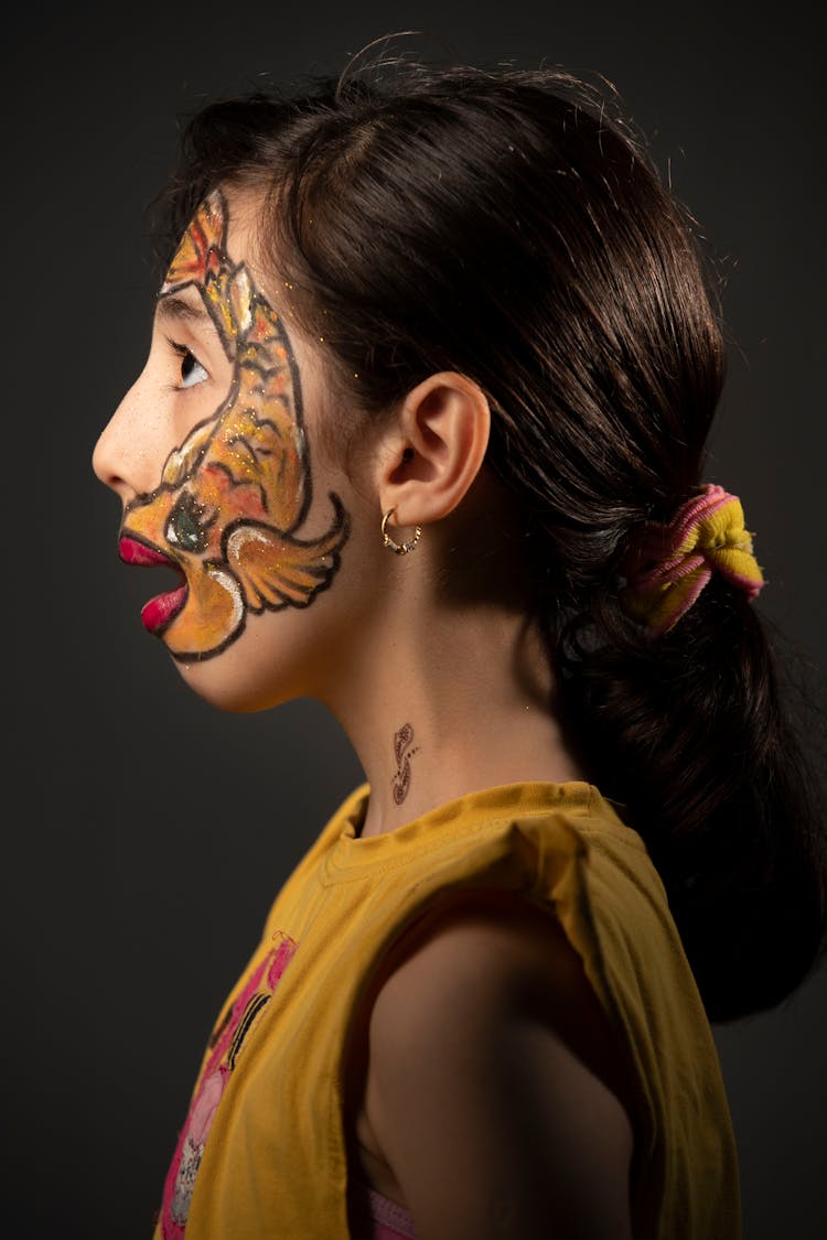 A Girl  With Fish Painting On Face