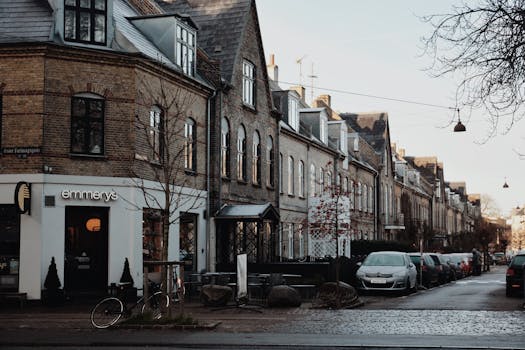 Explore a quaint Danish street lined with historic architecture and a cozy bakery.