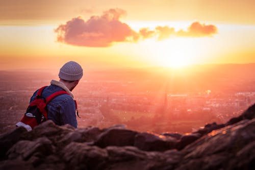 A Man Enjoying the City View from the Mountain 