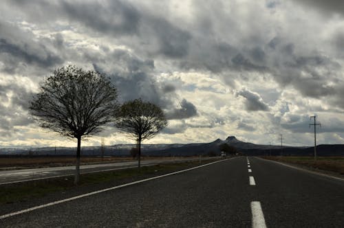 An Empty Road Under the Cloudy Sky