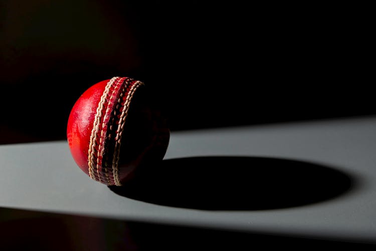 Close-Up Photo Of A Red Cricket Ball