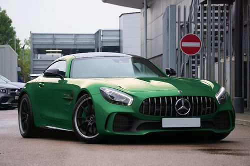 Free Luxury green Mercedes-AMG GTR sports car parked on a city street in the UK. Stock Photo