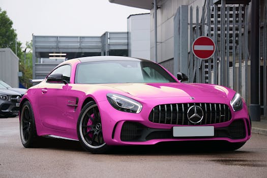 Bright pink luxury sports car parked on a city street in the UK. Modern automotive design.