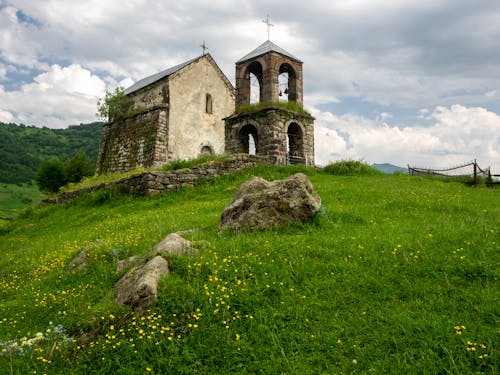 Old Church And Bell Tower In Mountains