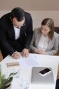 Man in Black Suit Jacket Holding White Paper