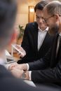 Man in Black Suit Jacket Using Macbook Pro