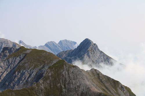 An Aerial Photography of a Mountain Under the White Sky