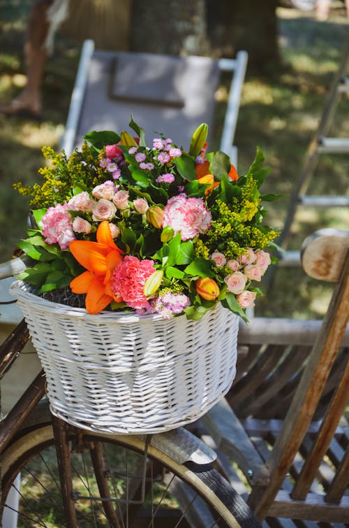 Shallow Focus of Colorful Flowers in White Basket