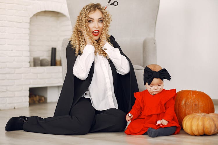 Mother And Baby Daughter In Halloween Costumes