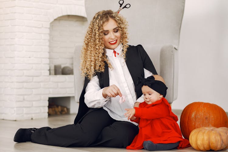 Mother And Baby Daughter In Halloween Costumes