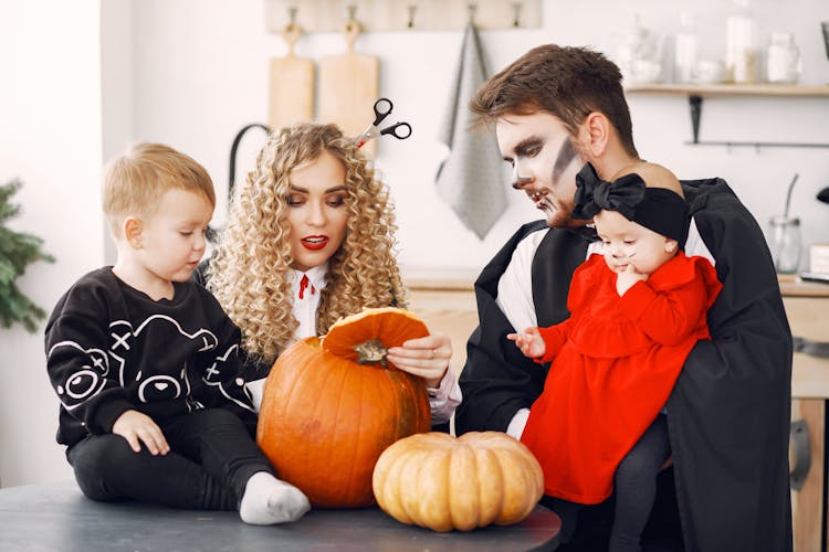 A Family Wearing Halloween Costumes