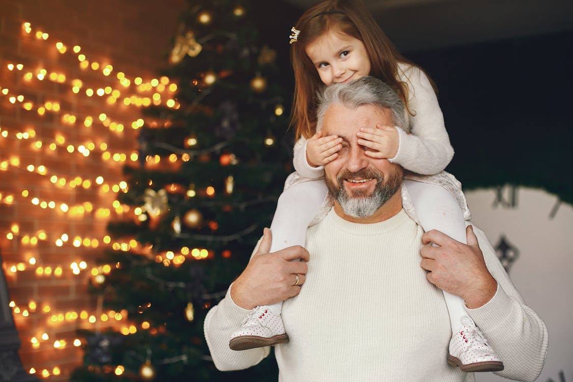 Free Cute Girl Riding Her Dad's Shoulder Stock Photo