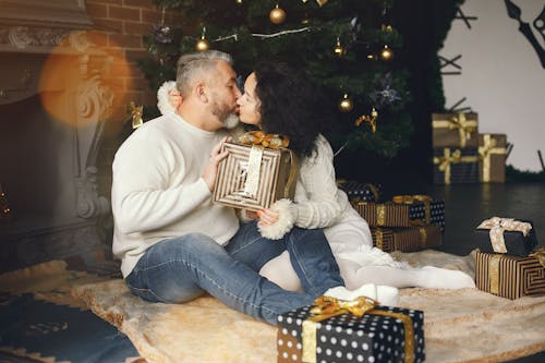 Loving Husband Giving a Christmas Present to His Wife