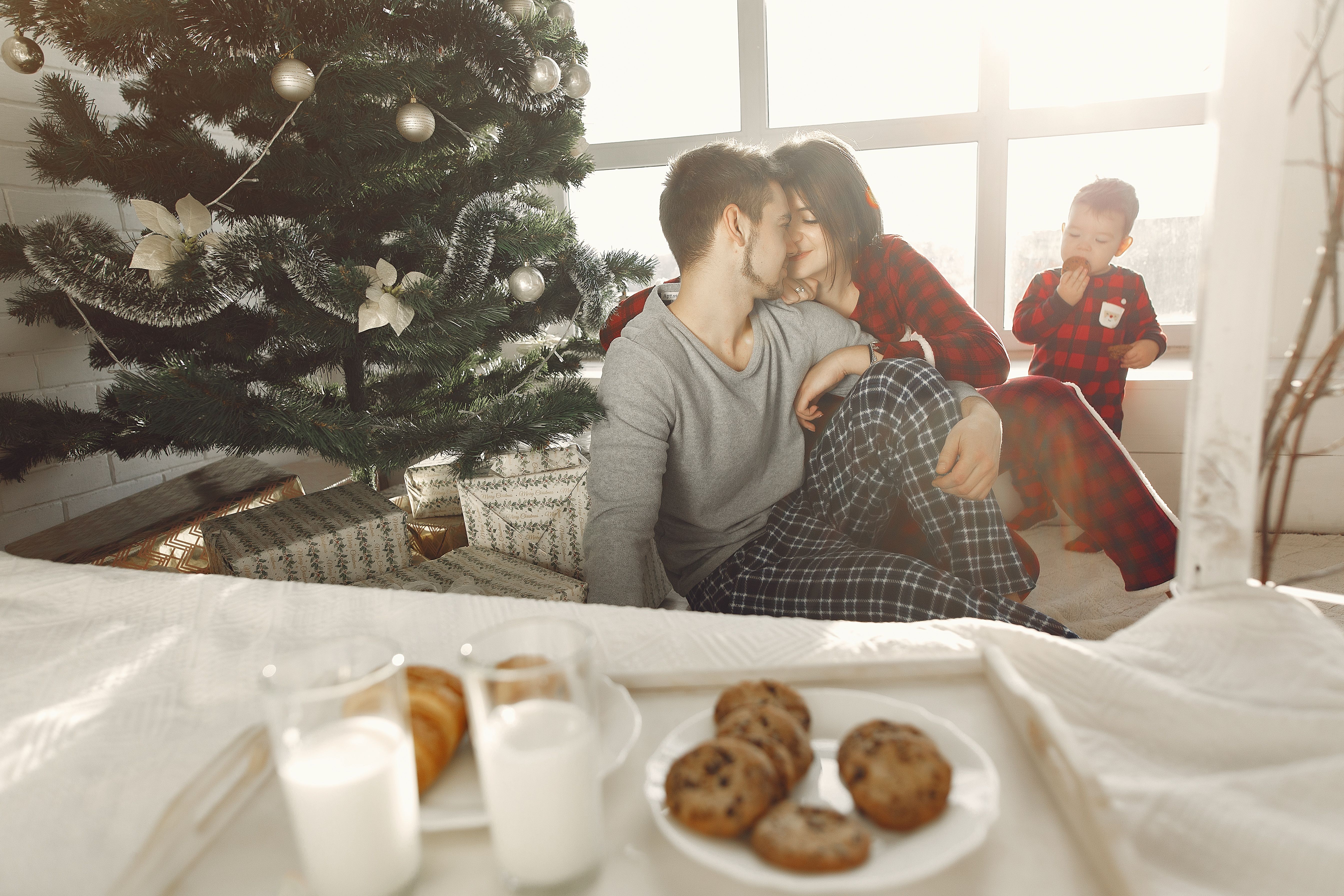 Family enjoying Christmas morning together — cozy and happy